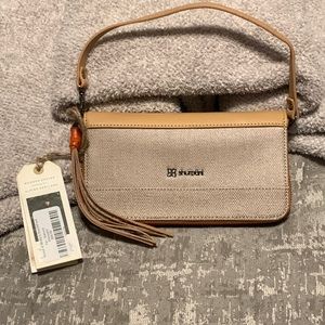 Very chic natural wristlet by Sherpani